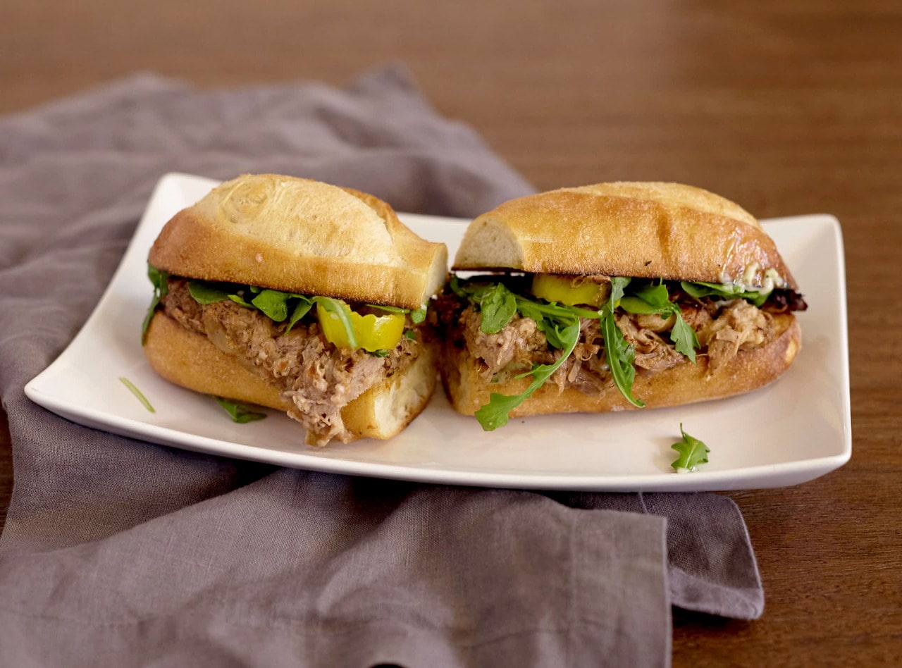 Slow-cooked Pork with Kale Pesto Baguette Sandwich with Side Salad by Chef Lilly Gjekmarkaj